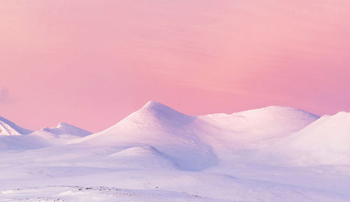 Scenic view of snowcapped mountains against sky during winter