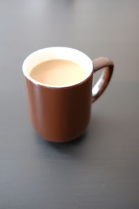 High angle view of coffee cup on table