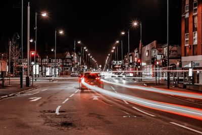 Light trails through busy town at night