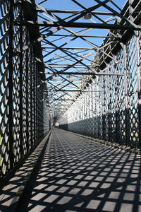 Shadow of bridge against sky