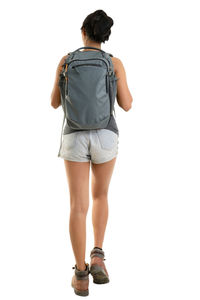 Rear view of woman standing against white background