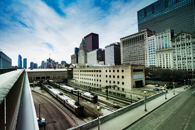 Buildings in city against sky