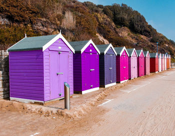 Beach huts against buildings