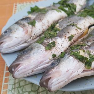 High angle view of fish in plate on table