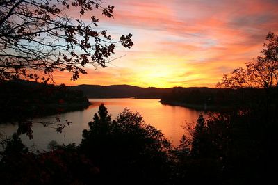 Scenic view of lake against sky during sunset