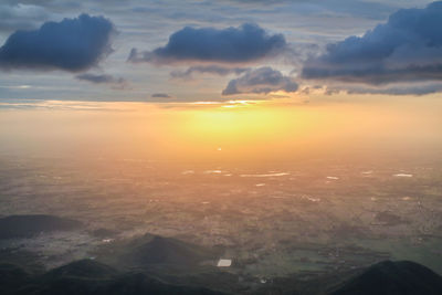 Scenic view of sunset over city