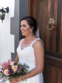 Young woman holding flower bouquet