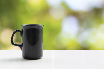 Close-up of coffee cup on table