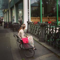Rear view of man walking in bus