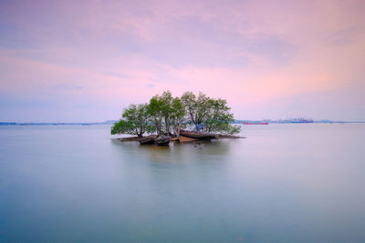Scenic view of sea against sky at sunset