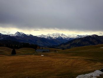 Scenic view of snowcapped mountains against sky