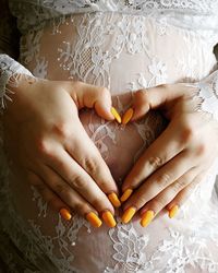 Close-up of woman holding hands