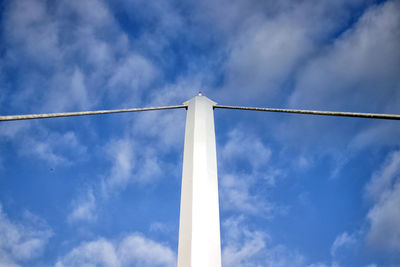 Low angle view of tower against blue sky