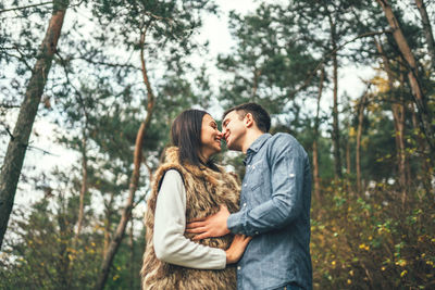 Young couple standing in forest