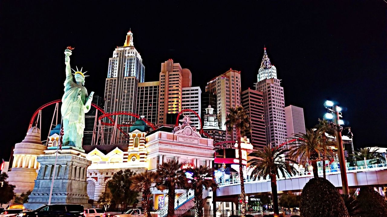 LOW ANGLE VIEW OF BUILDINGS AT NIGHT