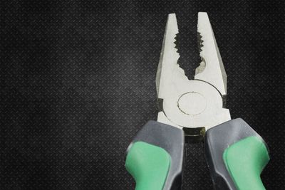 Low section of person standing on metal