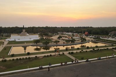 High angle view of people on road against sky during sunset