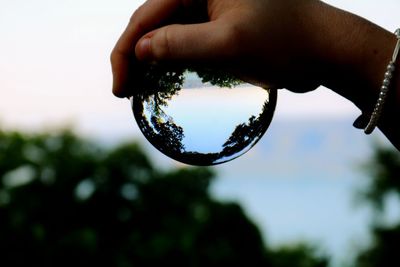 Close-up of person holding bubbles