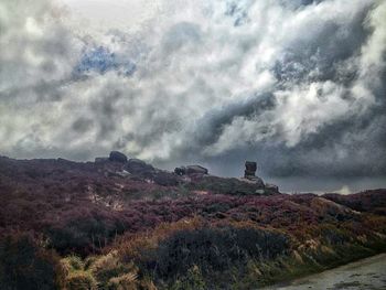 Scenic view of landscape against cloudy sky