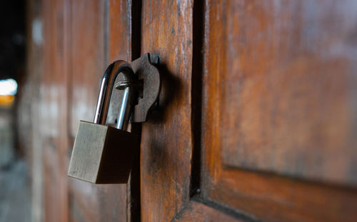 Close-up of padlock on door