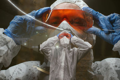 Digital composite image of man wearing protective workwear