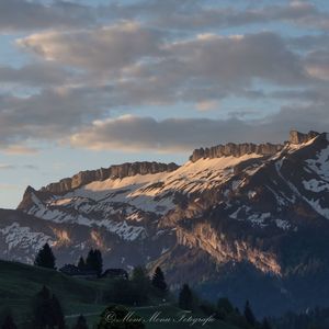 Scenic view of mountains against sky during sunset