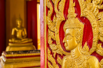 Buddha statue in temple outside building