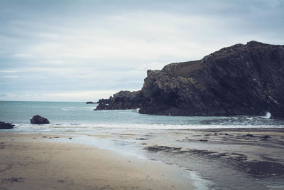 Scenic view of beach against sky