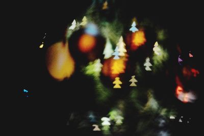 Close-up of illuminated christmas tree at night