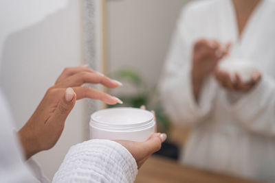 Midsection of doctor examining patient in clinic