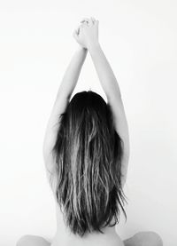 Young woman against white background