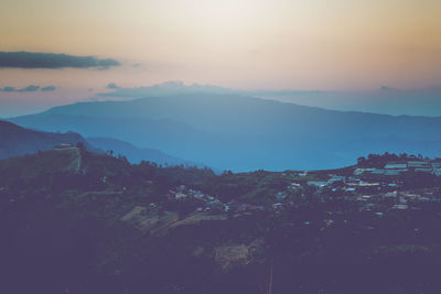 High angle view of mountains against sky during sunset