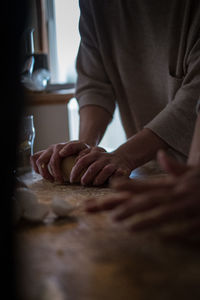 Midsection of man preparing food at home