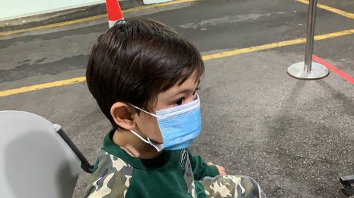 High angle portrait of boy on road