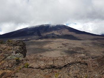 Scenic view of volcanic mountain against sky