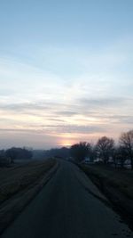 Scenic view of field against sky during sunset