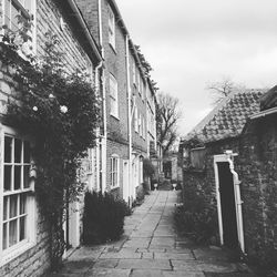 Walkway amidst buildings