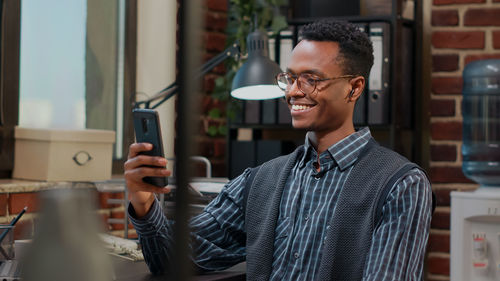 Smiling businessman talking on video conference