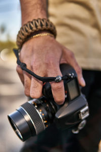 Close-up of man holding camera