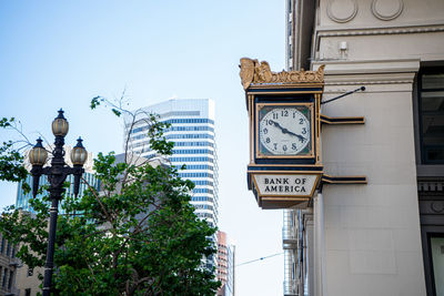 Low angle view of clock tower against clear sky