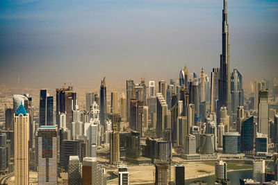 Panoramic view of modern buildings in city against sky