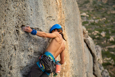 Baby boy on rock