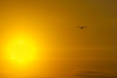 Low angle view of airplane flying in sky