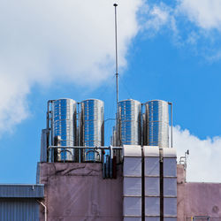 Low angle view of factory against sky