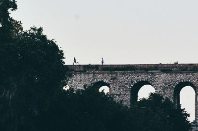 Low angle view of bridge against clear sky