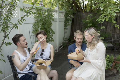 Couples eating churros at a party