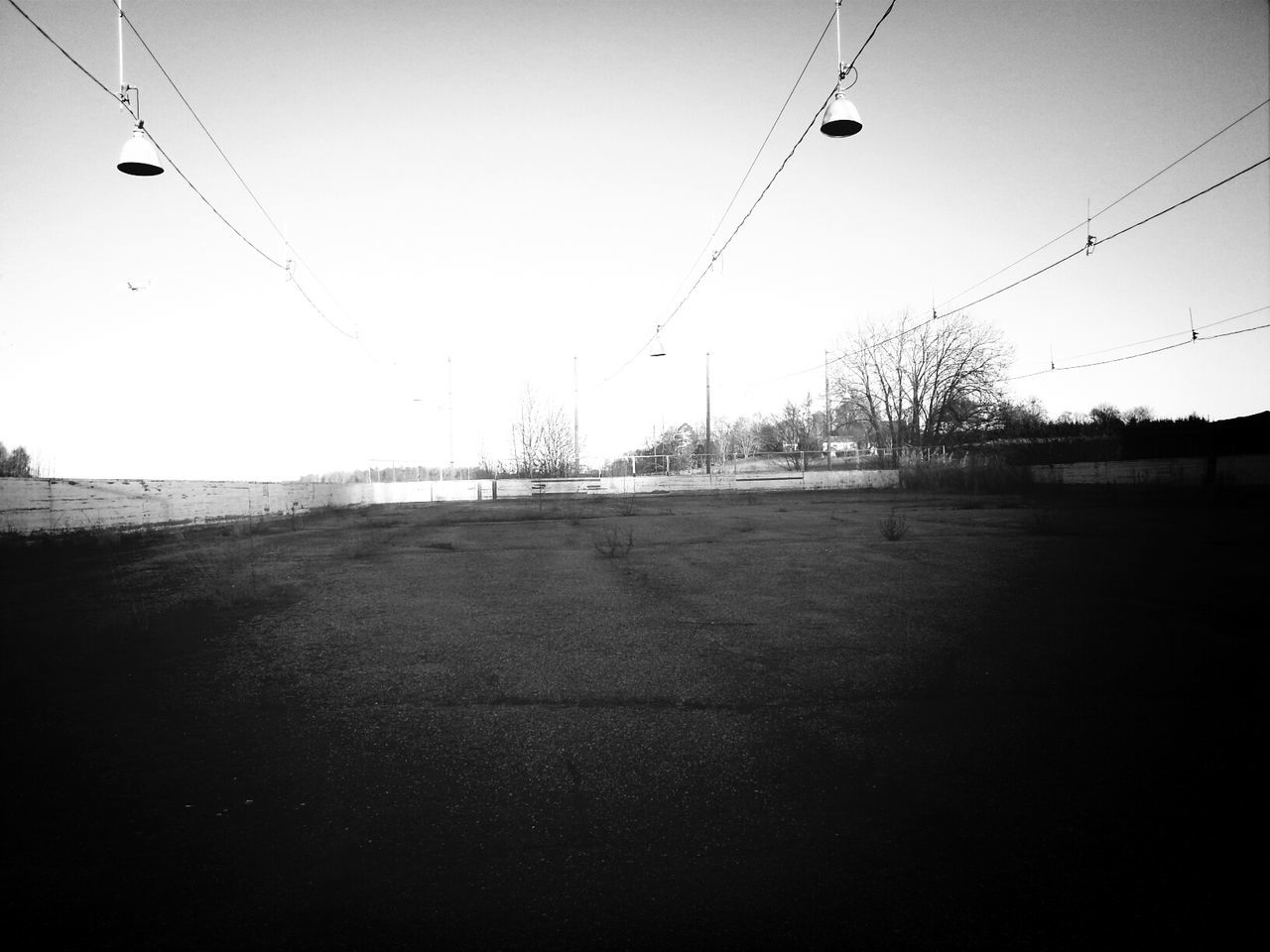 power line, electricity pylon, cable, clear sky, electricity, power supply, transportation, connection, road, sky, the way forward, power cable, silhouette, street light, street, fuel and power generation, outdoors, technology, sunset, dusk