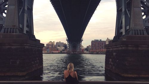 Rear view of woman overlooking cityscape