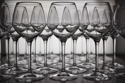 Close-up of wine glasses arranging on table