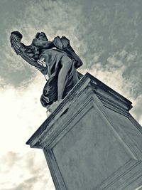 Low angle view of statue against cloudy sky